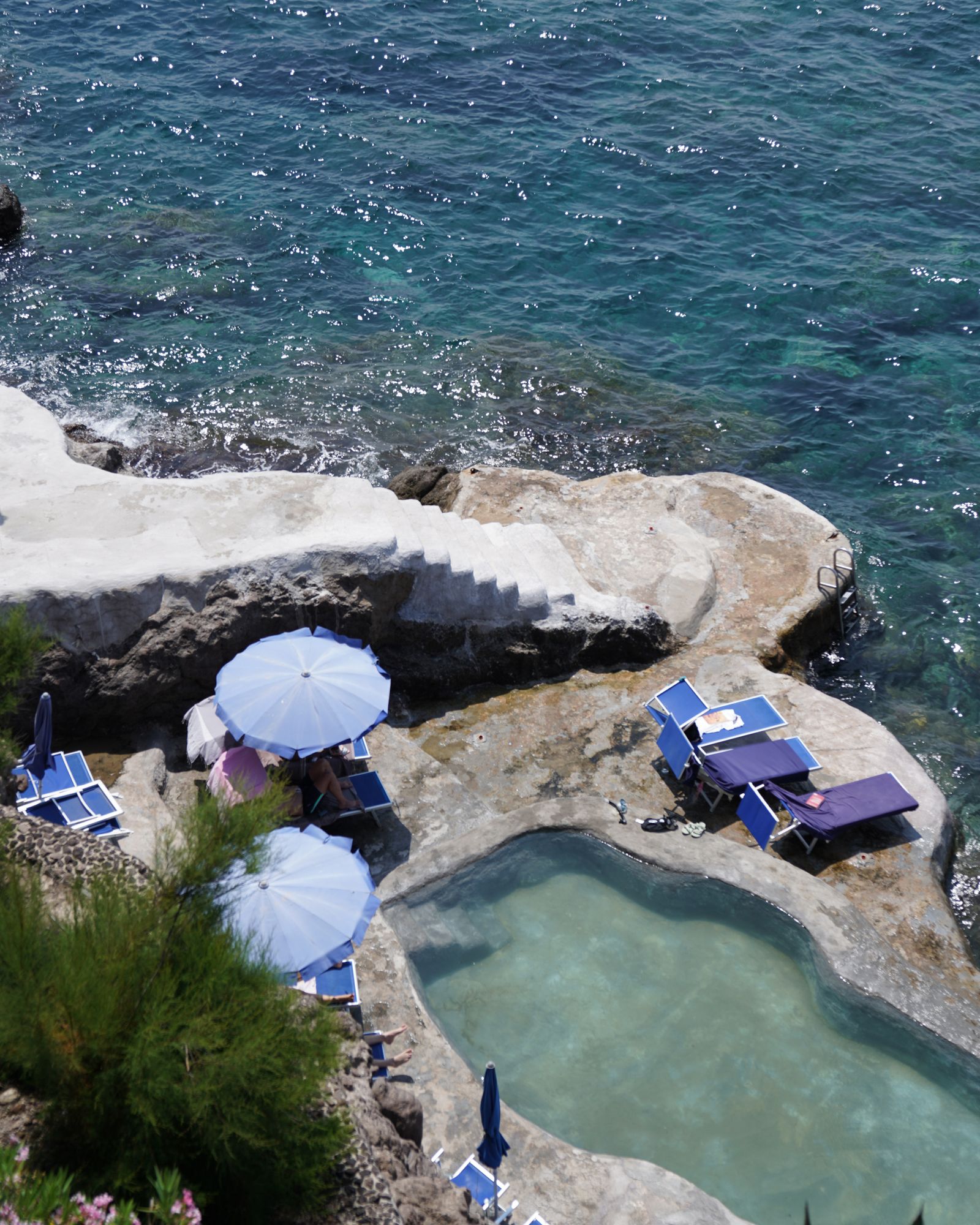 Image may contain Architecture Building Outdoors Shelter Summer Rock Nature Scenery Sea Water Beach and Coast