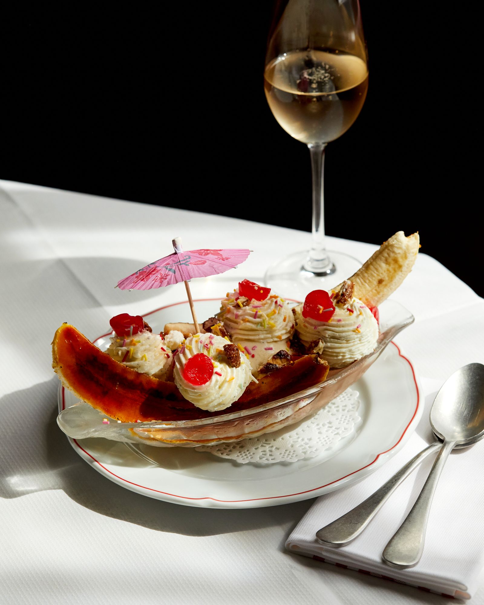 Image may contain Food Food Presentation Cutlery Spoon Cream Dessert Sundae Plate Dining Table Furniture and Table