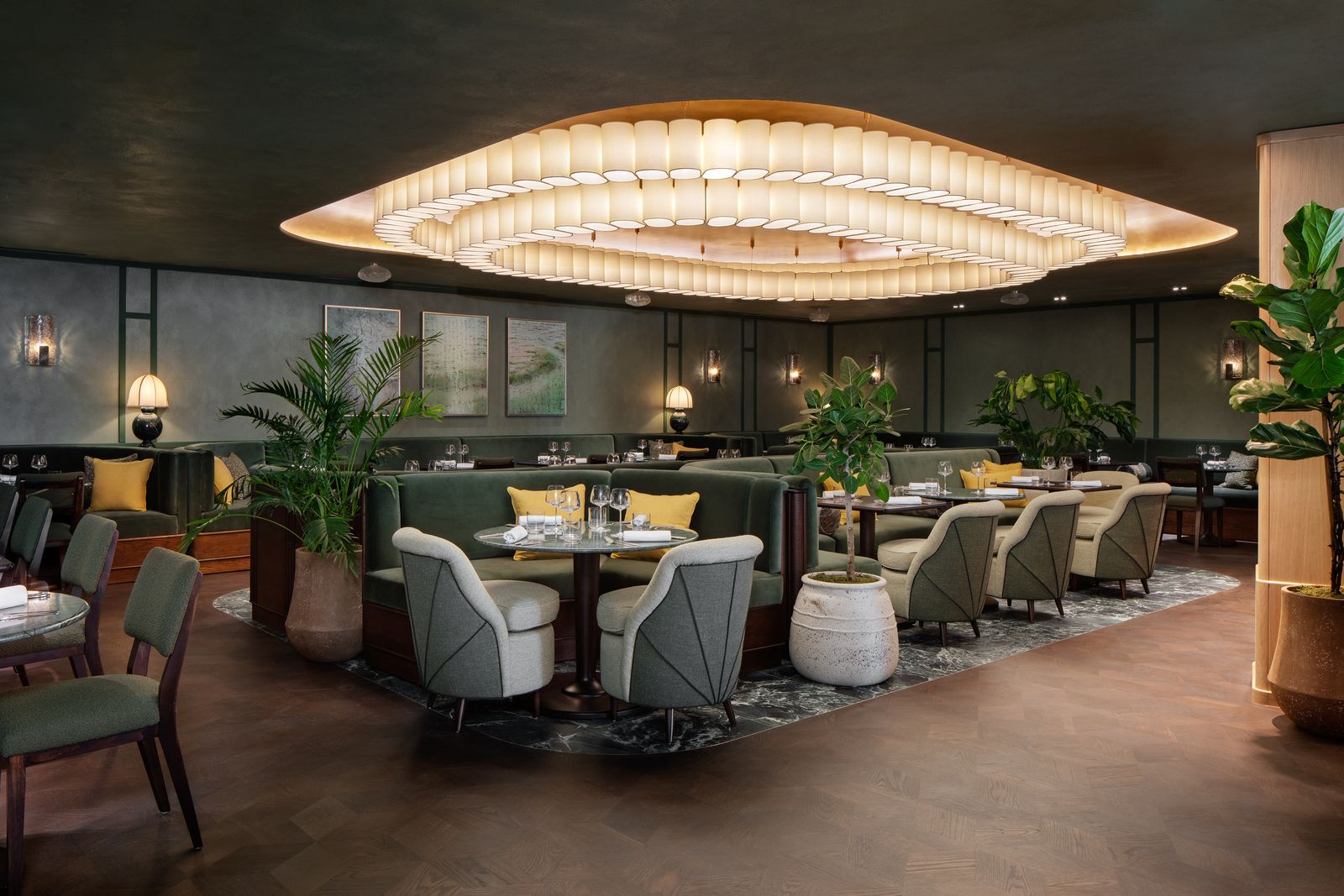 Image may contain Architecture Building Dining Room Dining Table Furniture Indoors Room Table Lamp and Plant